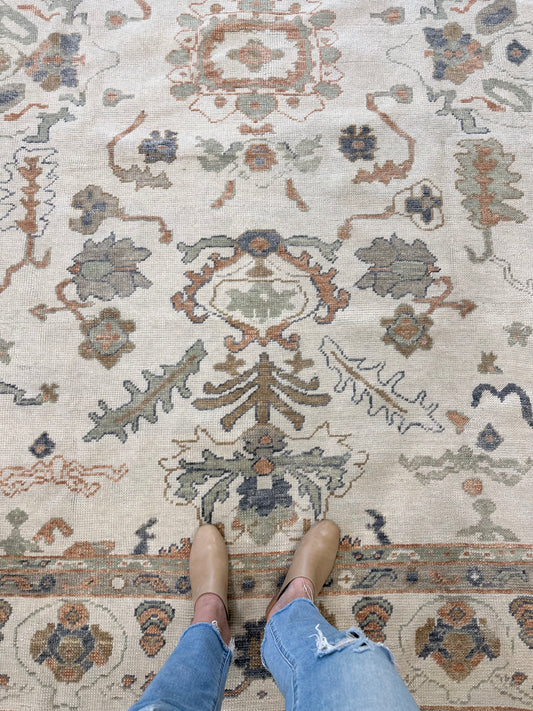 Neutral Turkish Oushak Rug with blues, greens, and oranges closeup in Fairhope, AL