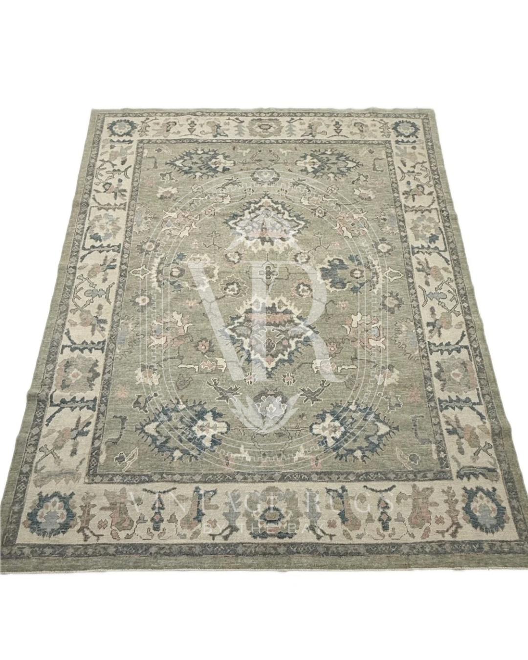 Full picture design of Gertrude Sage Green Turkish Oushak rug featuring a soft sage green base with accents of turquoise, salmon, cream, light blue, and gray in a timeless hand-knotted traditional pattern, perfect for living rooms, bedrooms, and elegant neutral interiors.