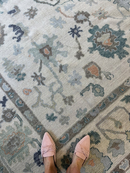 Opal Turkish Oushak rug in off-white with green, teal, orange, navy, and brown, hand-knotted wool