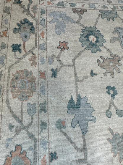 Olivia hand-knotted wool Turkish Oushak rug, off-white base with layered gray, teal, and muted orange