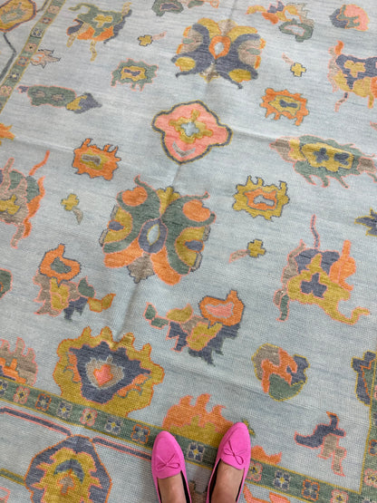 Layla modern Oushak rug, hand-knotted wool with a light blue foundation and chartreuse, green, coral, and dark periwinkle accents
