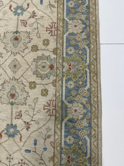 Willa hand-knotted wool modern Oushak rug in beige with olive, gray-blue, and taupe tones