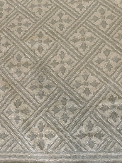 Lois wool flatweave rug with a soft oat and taupe palette