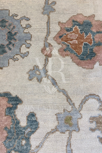 Posey Turkish Oushak rug, ivory with bold chartreuse border and turquoise, salmon, light blue, and warm brown accents