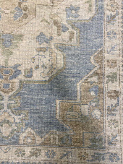 Molly Turkish Oushak rug, hand-knotted wool with a light blue foundation and light green, warm tan, cream, and rich brown accents