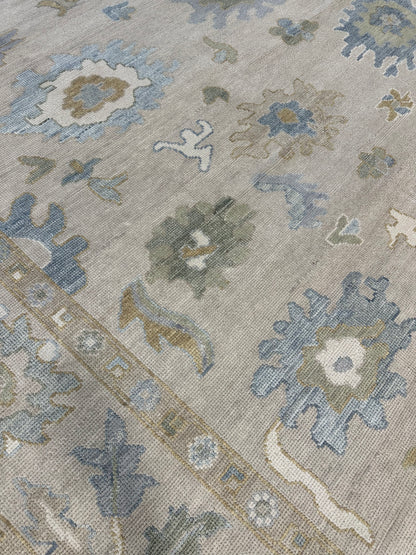 Eliza Modern Oushak rug styled in a room, neutral base, soft green, gray-blue, cream, warm gold, hand-knotted wool