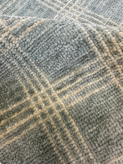 Close-up of Evie Modern Oushak rug showing gray-blue, very light warm gray, hand-knotted wool