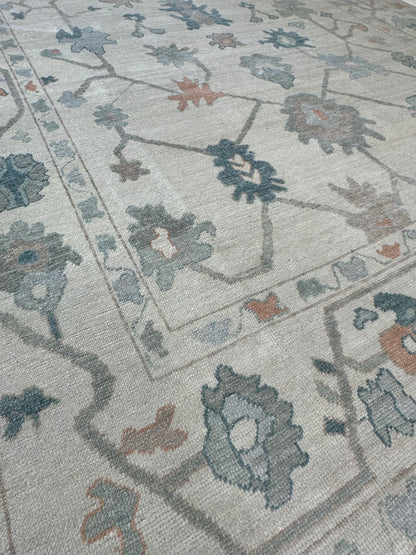 Olivia Turkish Oushak rug in off-white with teal, orange, gray, and brown, hand-knotted wool