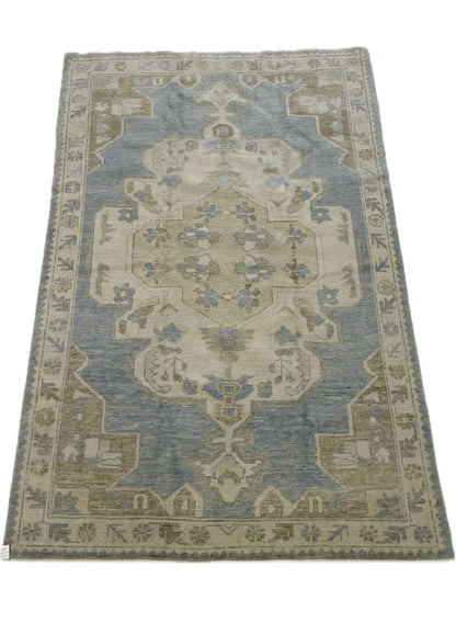 Molly light blue Turkish Oushak rug with light green, warm tan, cream, and brown accents, hand-knotted wool