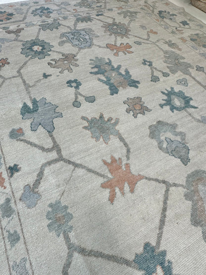 Olivia off-white and gray Turkish Oushak rug with teal, light blue, muted orange, and brown accents