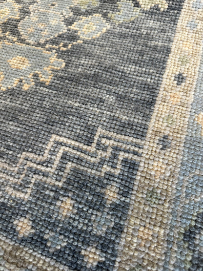 Harriet Turkish Oushak rug, hand-knotted wool with a navy foundation and green, tan, and cream accents