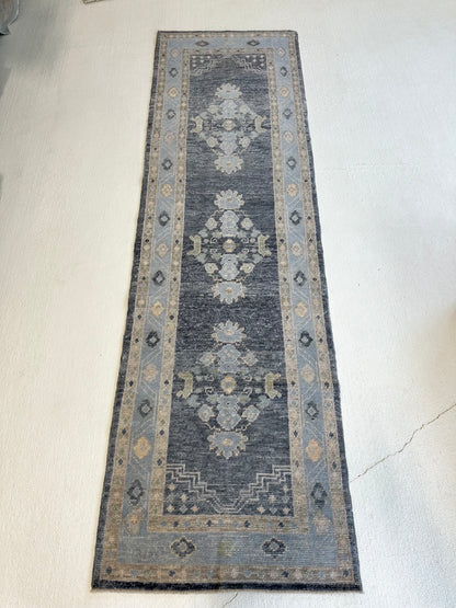 Harriet Turkish Oushak rug, navy foundation with green, tan, and cream accents