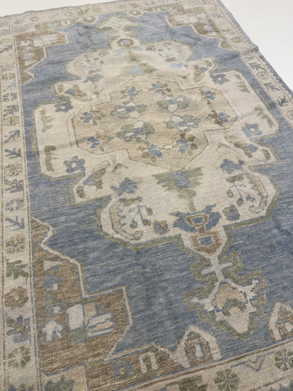 Molly hand-knotted wool Turkish Oushak rug in light blue with green, tan, cream, and brown tones