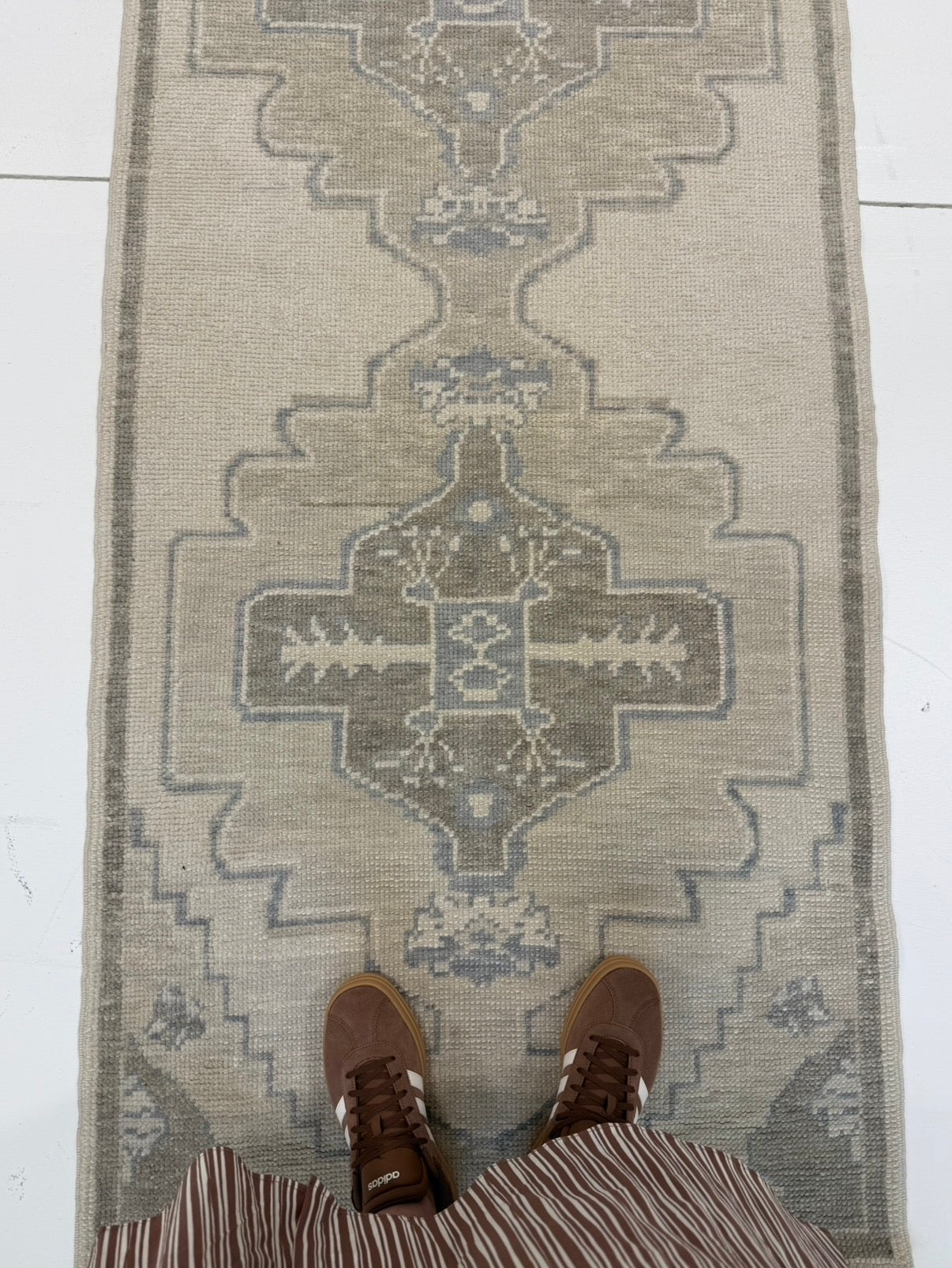 Bethany Blue Turkish oushak rug — warm gray foundation with tan, cool brown, and soft gray-blue accents, hand-knotted 100% wool area rug