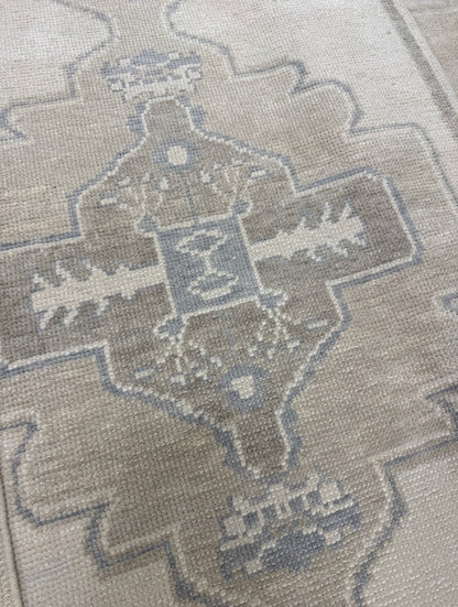 Bethany Blue turkish oushak rug close up — warm gray wool with tan and gray-blue accents, hand-knotted in Turkey, custom sizes available