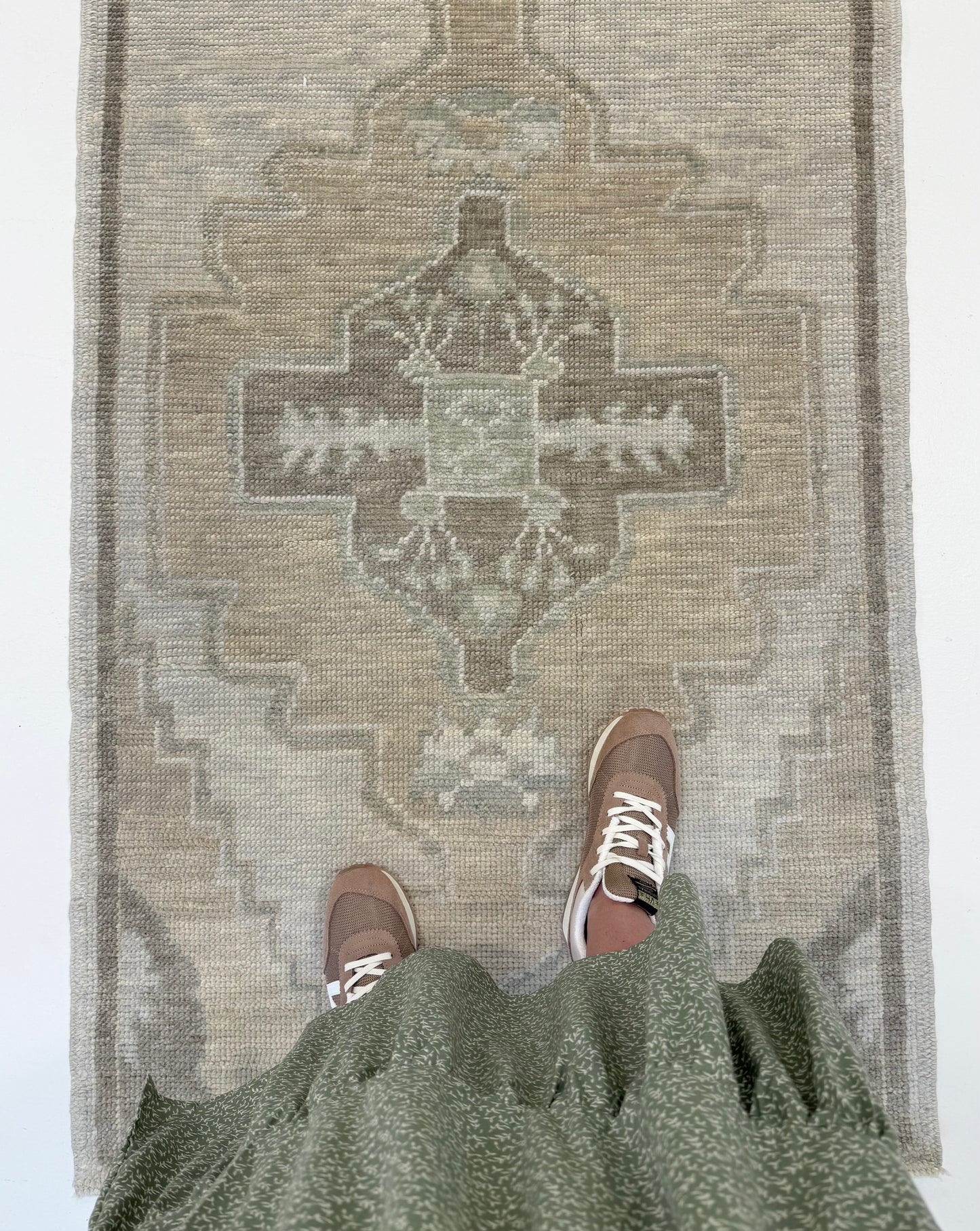 Bethany Turkish Oushak Neutral Runner with person standing on in Fairhope, Alabama.