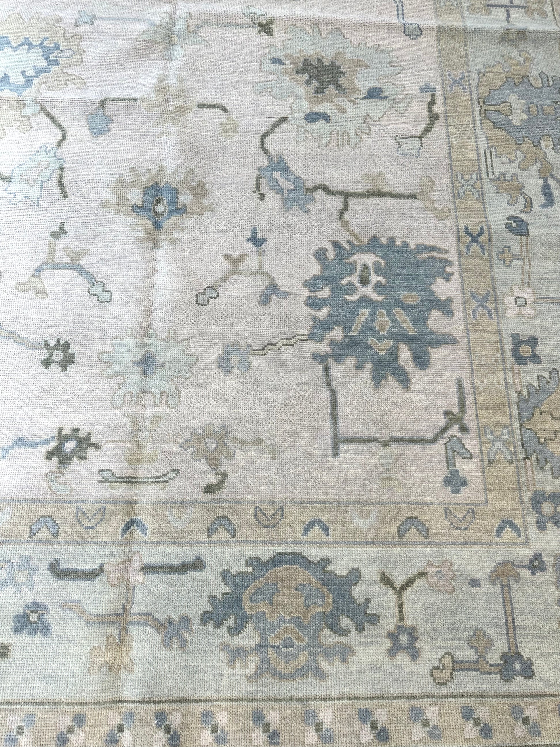 Closeup of Evangeline modern Oushak bestselling blue and green rug That is hand knotted and wool