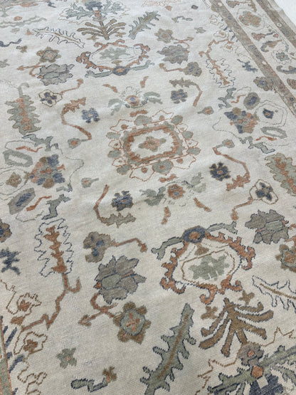 Neutral Turkish Oushak Rug with blues, greens, browns, and oranges closeup in Fairhope, AL
