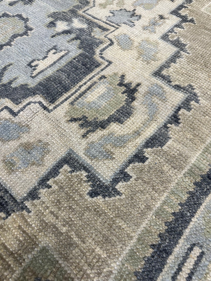 Close-up of Clara Turkish Oushak rug showing navy, green, tan, cream, hand-knotted wool