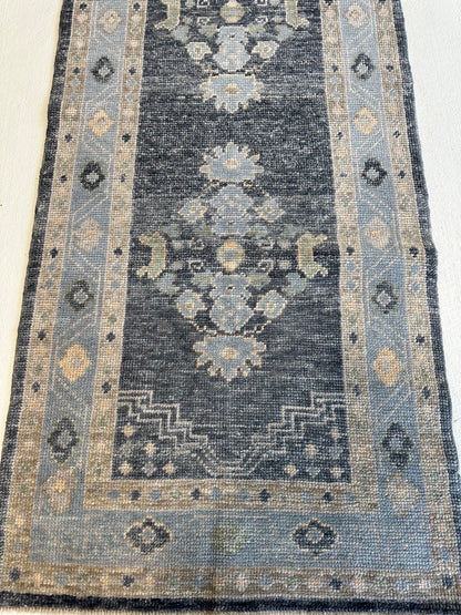Harriet Turkish Oushak rug, hand-knotted wool with a navy foundation and green, tan, and cream accents