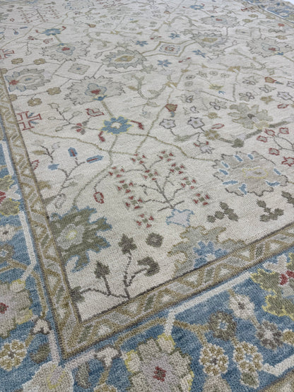 Willa beige and olive modern Oushak rug with gray-blue, taupe, red, and yellow accents, hand-knotted wool