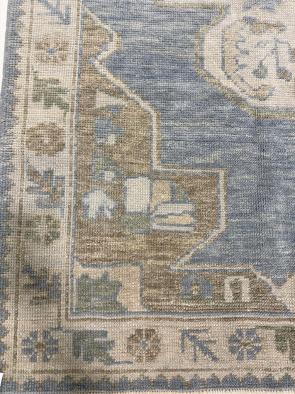 Molly light blue Turkish Oushak rug with light green, warm tan, cream, and brown accents, hand-knotted wool