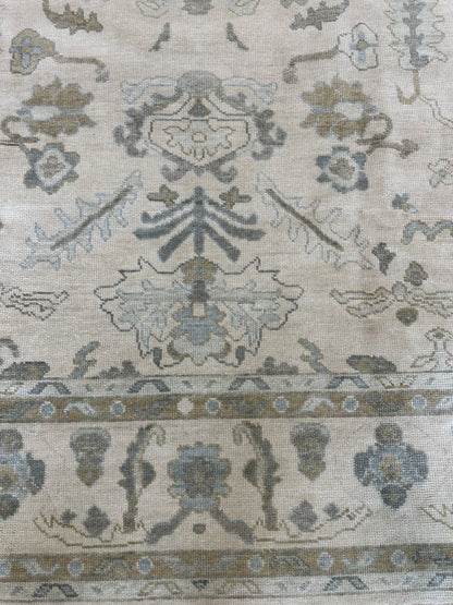 Kendal hand-knotted wool modern Oushak rug, warm cream with blue, tan, brown, and green tones