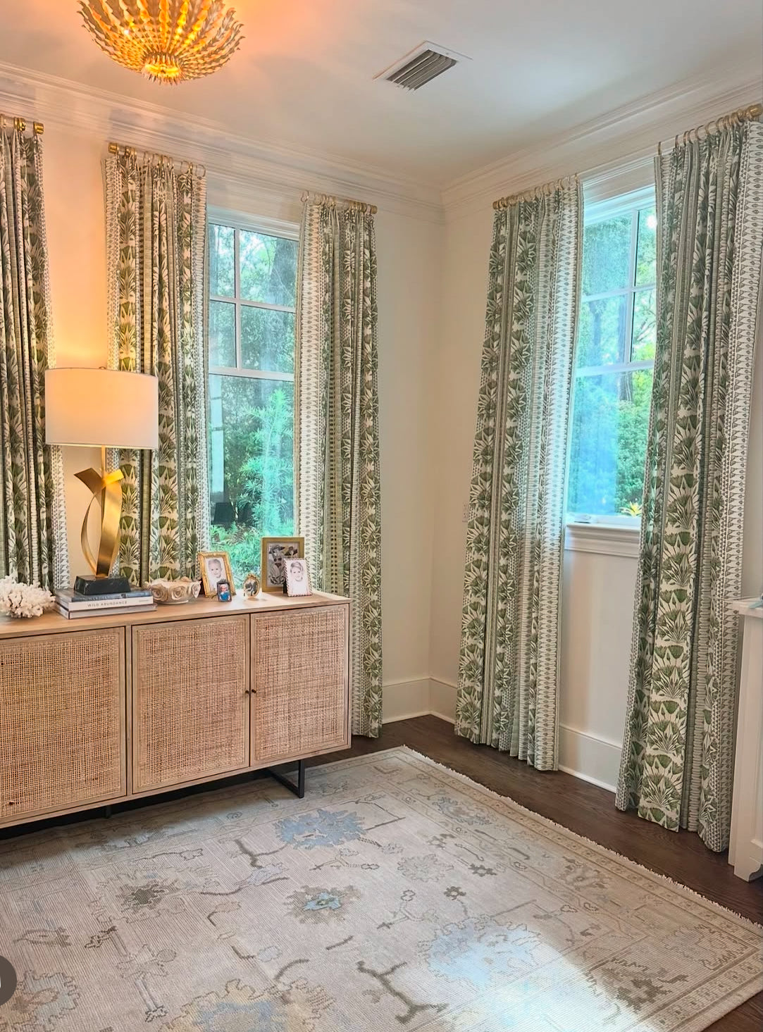 Evangeline Neutral Modern Oushak rug wi blues and greens in living room in Fairhope, AL