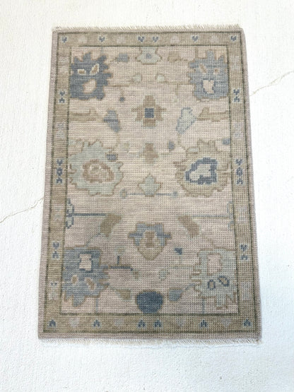 Evangeline Modern Oushak rug — hand-knotted wool in warm gray with warm gray, sage, mossy green, soft blue, tan
