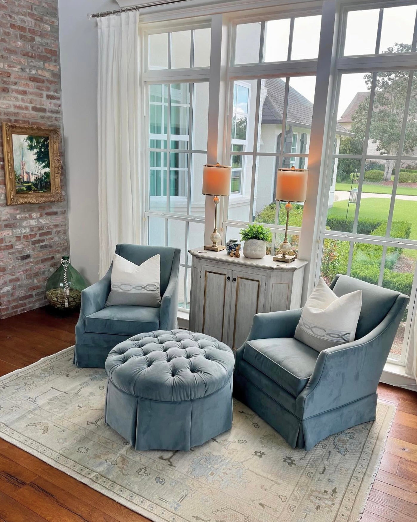Evangeline Modern Oushak Rug Neutral with blues and greens in sitting room with blue velvet chairs in Baton Rouge, LA and Salt Lake City, UT