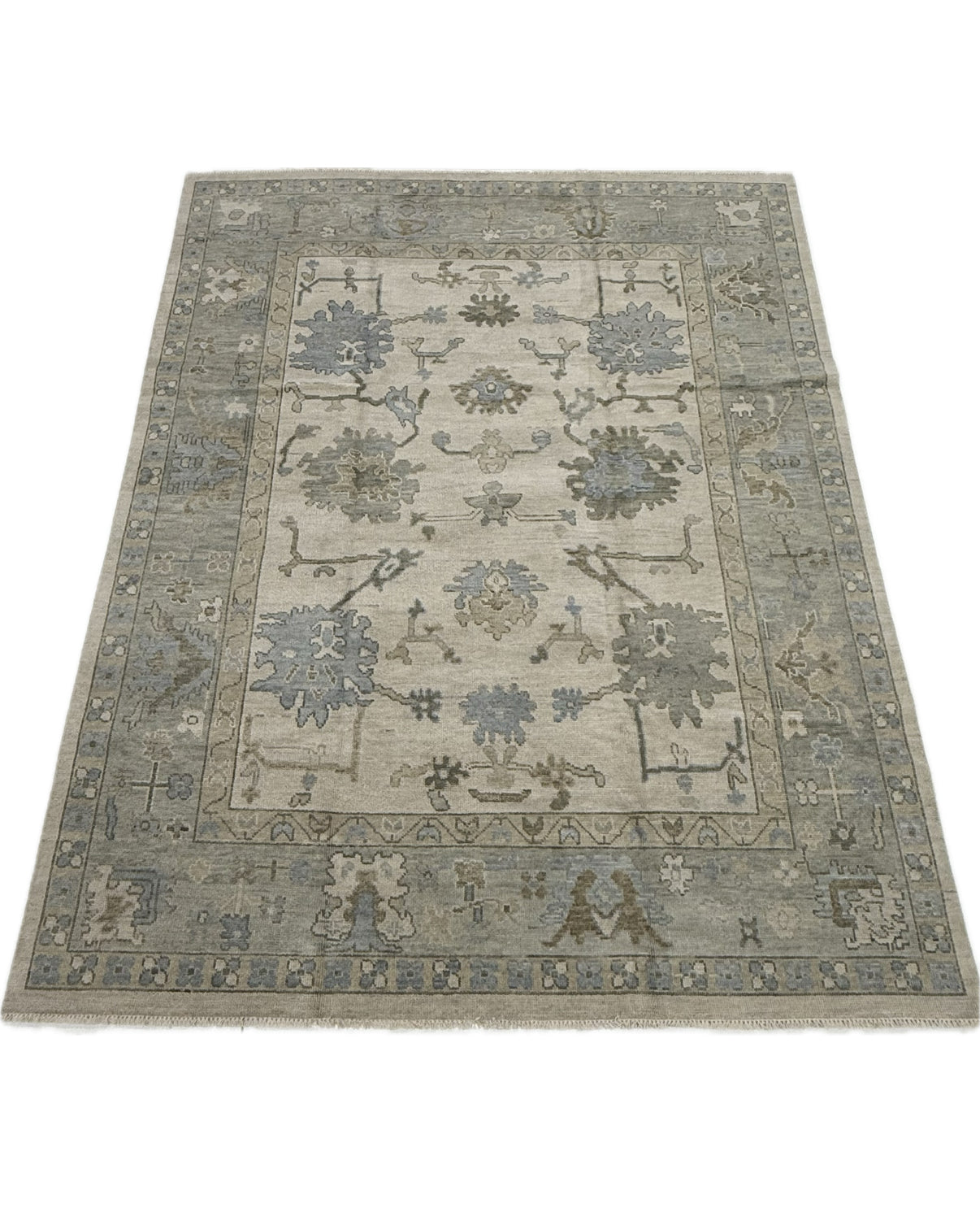 Neutral Modern hand knotted oushak rug with blues, greens, and browns and floral pattern