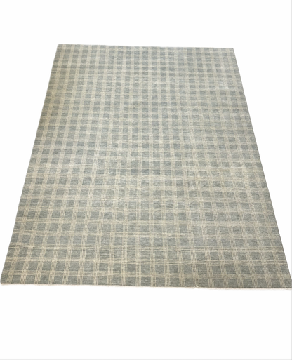Evie Modern Oushak rug styled in a room, gray-blue, very light warm gray, hand-knotted wool