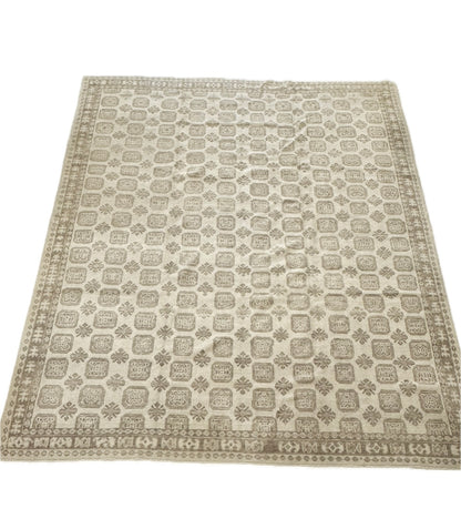 Kira Turkish Oushak rug, hand-knotted wool in a geometric pattern with warm brown, soft gray, and natural tan tones