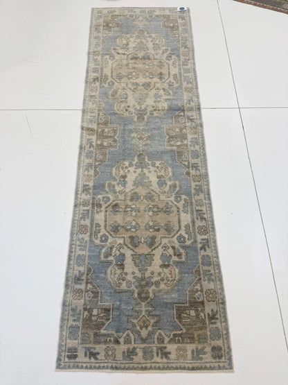 Molly hand-knotted wool Turkish Oushak rug in light blue with green, tan, cream, and brown tones