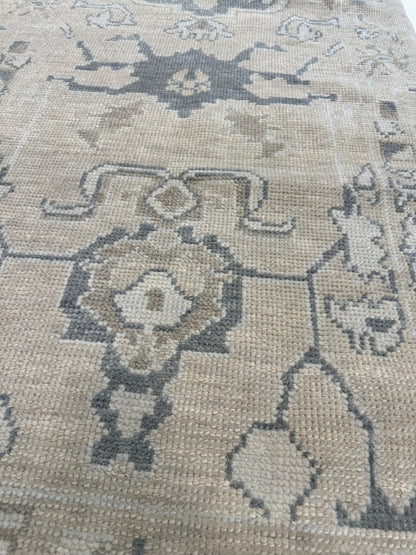 Close-up of Florence Turkish Oushak rug showing neutral, brown, cream, slate blue, hand-knotted wool