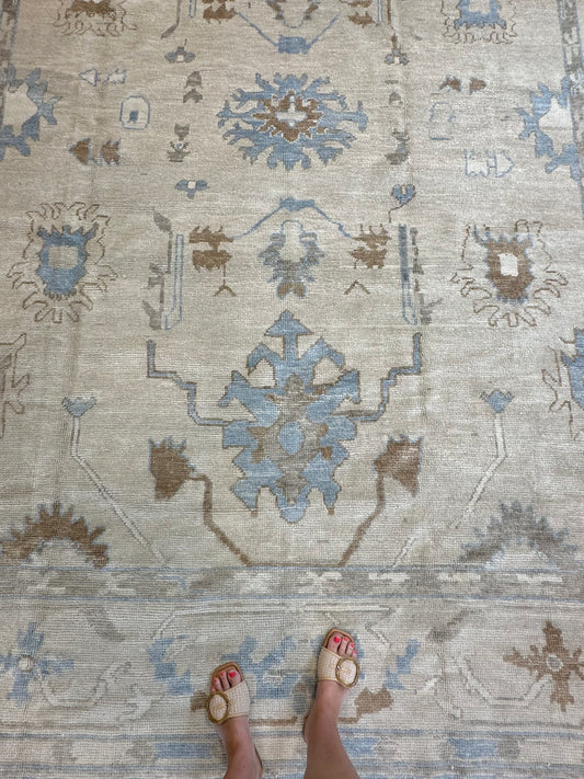Neutral Turkish hand-knotted modern oushak with accents of sepia, blue, and cream.