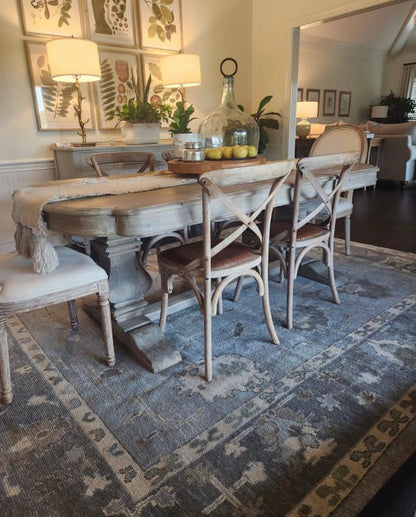 Josephine hand-knotted wool Turkish Oushak rug in light blue with slate gray border and earthy accents