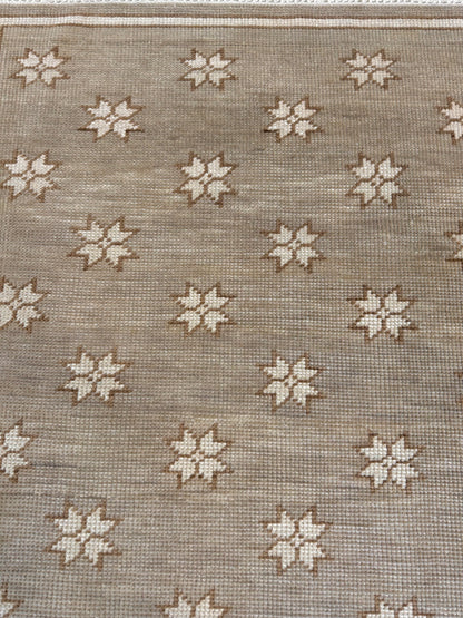 Rae hand-knotted wool modern Oushak rug in warm gray with sepia and ivory tones