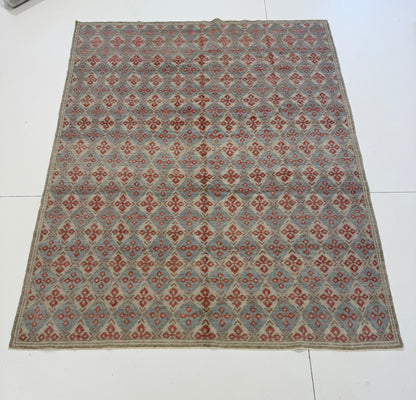 Martha Turkish Oushak rug, a diamond design in light blue, warm red, cream, and tan