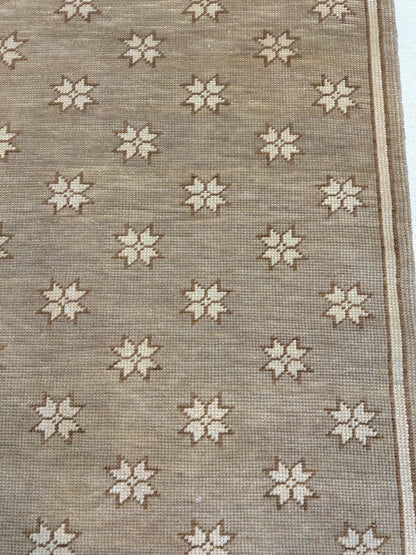Rae modern Oushak rug, warm gray with soft sepia and ivory accents