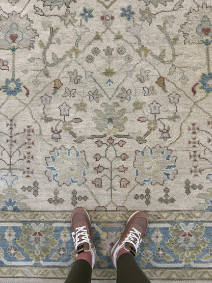 Willa modern Oushak rug, hand-knotted wool with a beige foundation and olive, gray-blue, taupe, red, and yellow accents