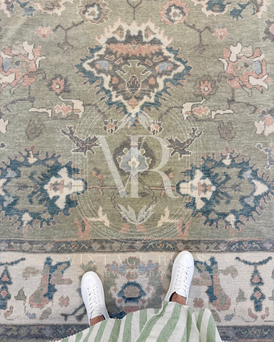 Gertrude Sage Green Turkish Oushak rug featuring a soft sage green base with accents of turquoise, salmon, cream, light blue, and gray in a timeless hand-knotted traditional pattern, perfect for living rooms, bedrooms, and elegant neutral interiors.