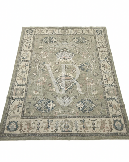 Full picture design of Gertrude Sage Green Turkish Oushak rug featuring a soft sage green base with accents of turquoise, salmon, cream, light blue, and gray in a timeless hand-knotted traditional pattern, perfect for living rooms, bedrooms, and elegant neutral interiors.
