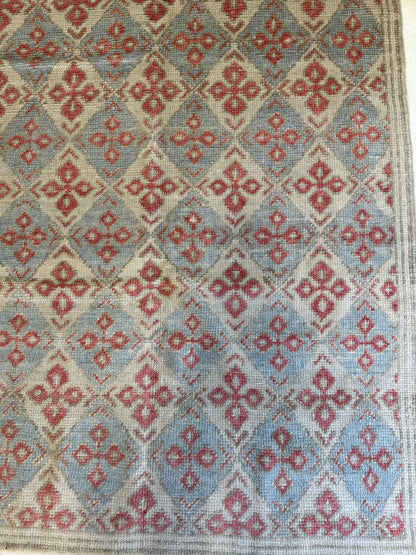 Martha hand-knotted wool Turkish Oushak rug in a diamond design in light blue, warm red, cream, and tan