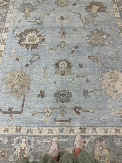 Blue Turkish Oushak Rug with accents of tan, cream, brown, gray, and green