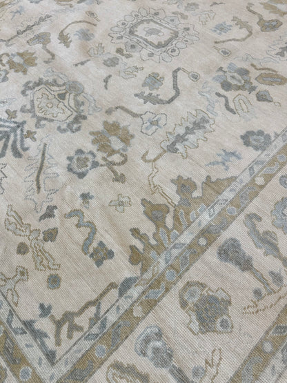 Kendal cream modern Oushak rug with light blue, tan, brown, and soft green accents, hand-knotted wool