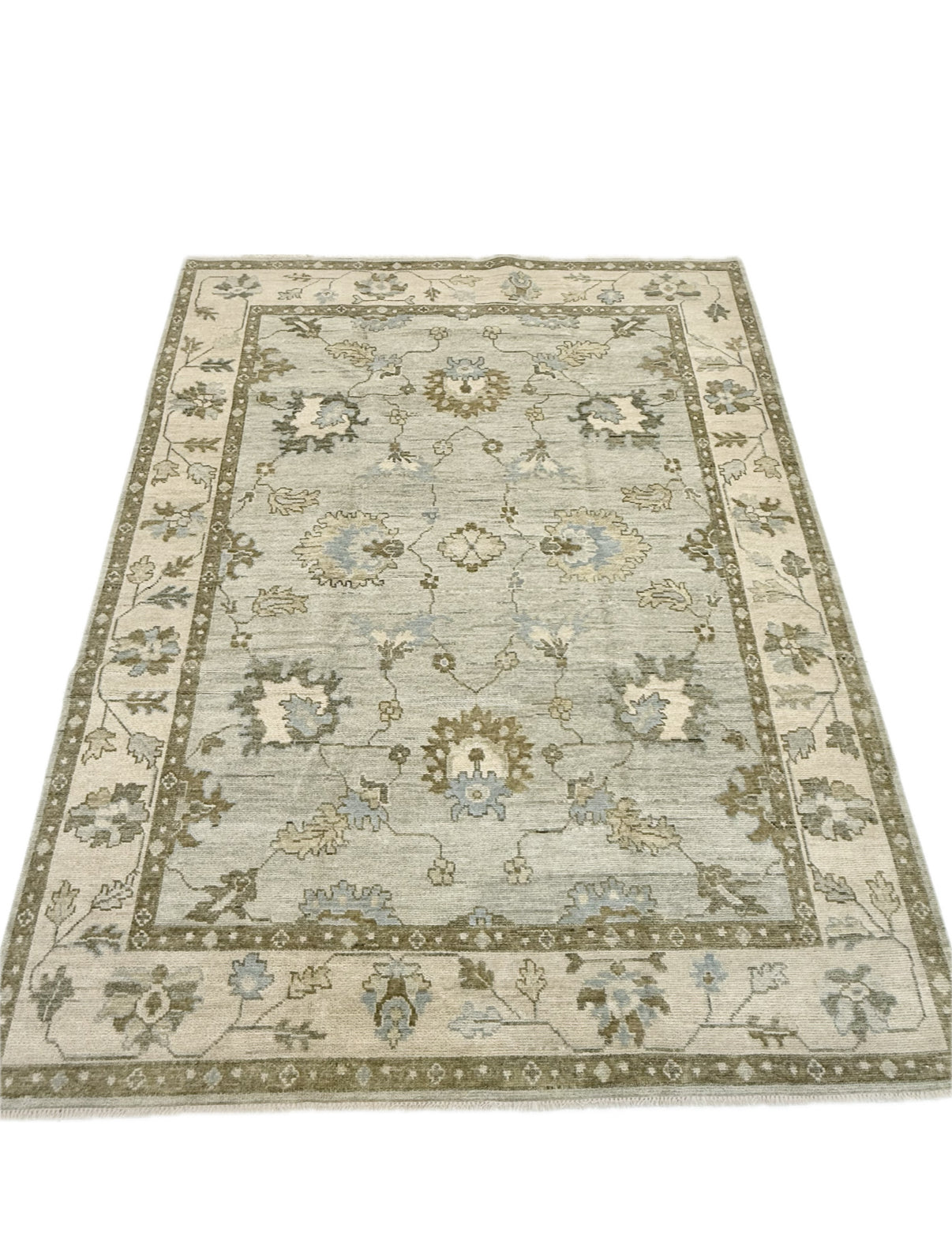 Full view of Lillian Sage Green Modern Oushak hand-knotted wool rug with blues, greens, creams and browns