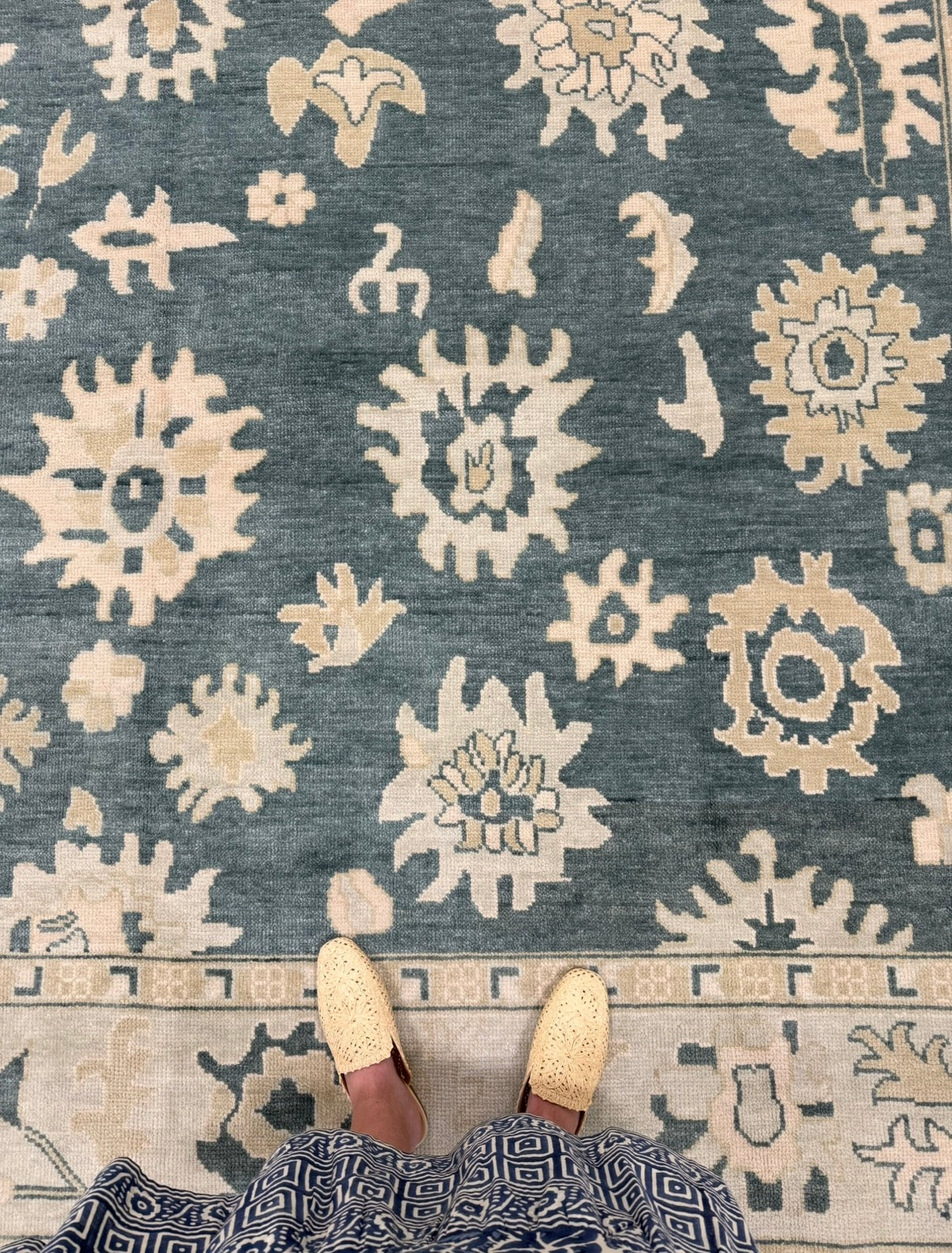 Lucille features a dark turquoise base, seafoam border, and cream and tan accents. Hand-knotted 100% wool oushak rug. In stock or made to order.
