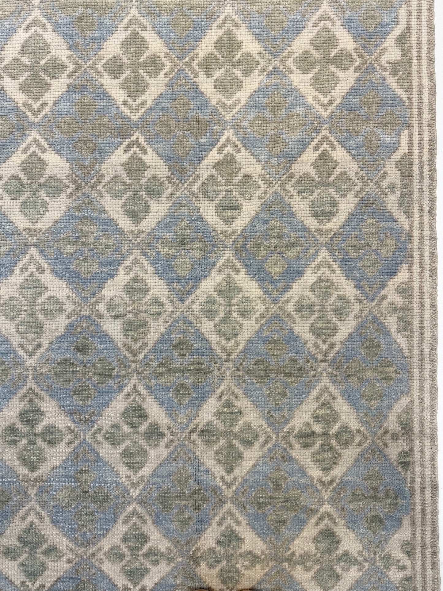Turkish Oushak  rug with blue, green, and beige diamond design