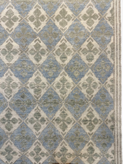 Turkish Oushak  rug with blue, green, and beige diamond design